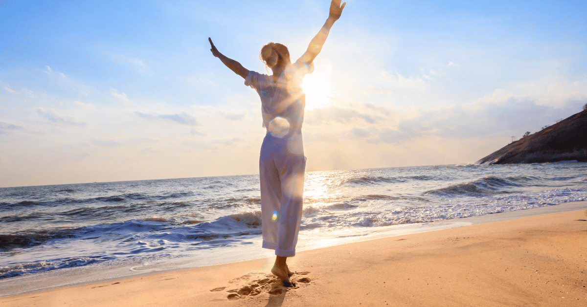 menopause natural remedies – woman doing yoga on the beach