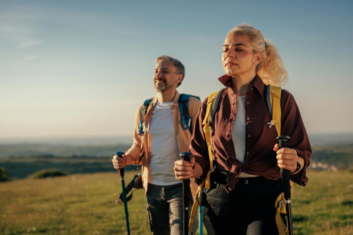 menopause self care – Couple enjoying a walk after improvements in energy and sleep